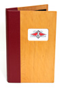 Wood cover front and back panel with 4 color tip-in logo. Cover designed with screw posts to hold multiple ribbon boards.